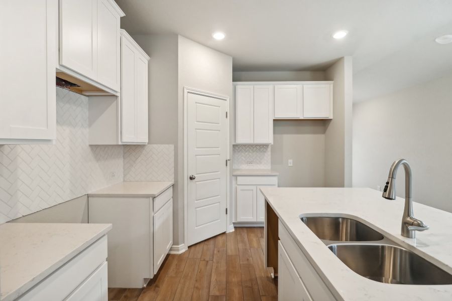 Kitchen in the Cascade floorplan at a Meritage Homes community.