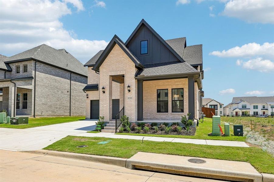 Featuring a charming front porch, dramatic gables and light colored brick paired with stunning dark trim, you'll enjoy fantastic curb appeal in this dream home! Featuring a charming front porch, dramatic gables and light colored brick paired with stunning dark trim, you'll enjoy fantastic curb appeal in this dream home!