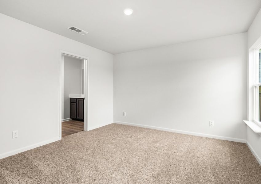 The master suite has a large bedroom, ensuite bathroom and walk-in closet.