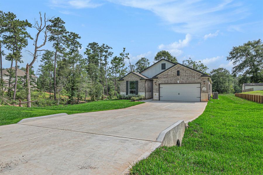 Front exterior of a new home in Oakwood Ranch, Willis, TX, highlighting curb appeal (Image 19).