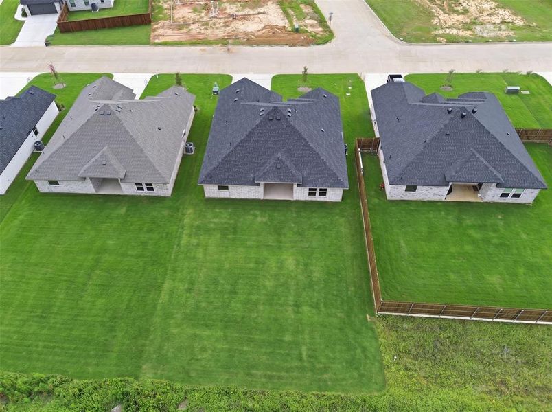 Front exterior of a new home in , Tolar, TX, highlighting curb appeal (Image 21).