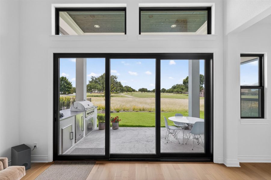 Golf course vistas await from this home's private patio featuring an outdoor kitchen. Golf course vistas await from this home's private patio featuring an outdoor kitchen.