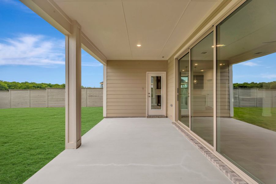 Exterior details and patio area of a home in Treeline, Justin (Image 3).