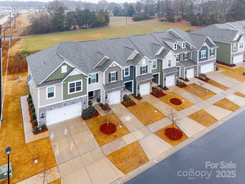 Front exterior of a new home in Secrest Landing, Monroe, NC, highlighting curb appeal (Image 23). Front exterior of a new home in Secrest Landing, Monroe, NC, highlighting curb appeal (Image 23).