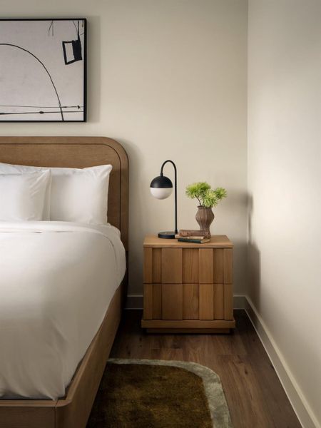 Warm wood floors ground this tranquil bedroom retreat. Warm wood floors ground this tranquil bedroom retreat.