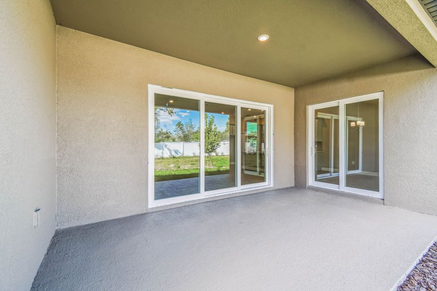 Exterior details and patio area of a home in Pinecone Reserve, Brooksville (Image 31).
