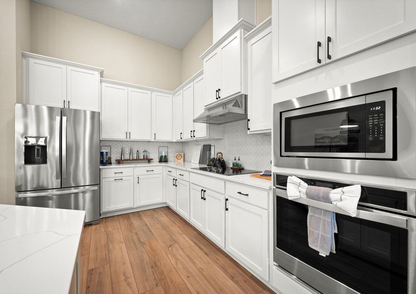 Kitchen with white cabinets.