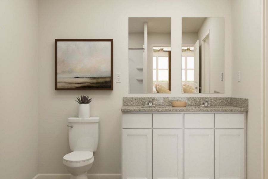 A bathroom with a large mirror.