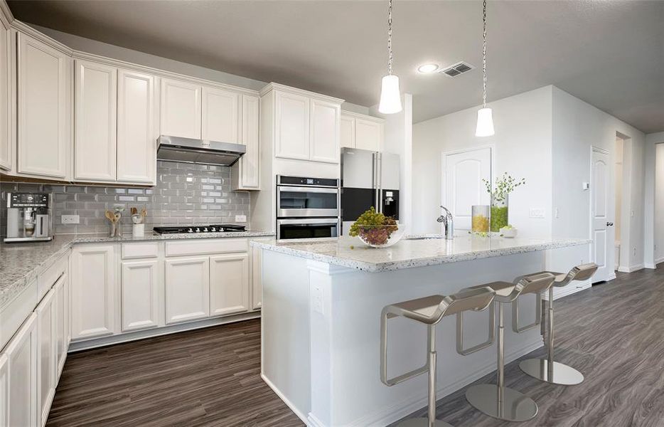 Spacious kitchen with eat-in bartop island *Model Representation*
