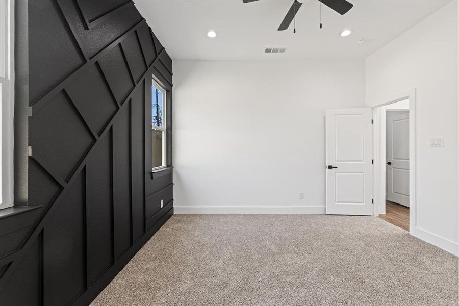 Unfurnished bedroom with light colored carpet, a ceiling fan, and recessed lighting