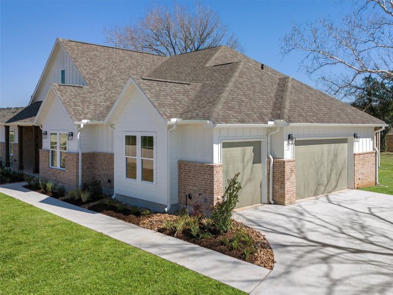 Front exterior of a new home in , Smithville, TX, highlighting curb appeal (Image 24).