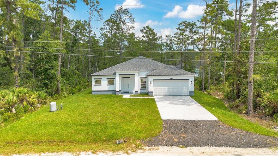 Front exterior of a new home in , Deland, FL, highlighting curb appeal (Image 1). Front exterior of a new home in , Deland, FL, highlighting curb appeal (Image 1).
