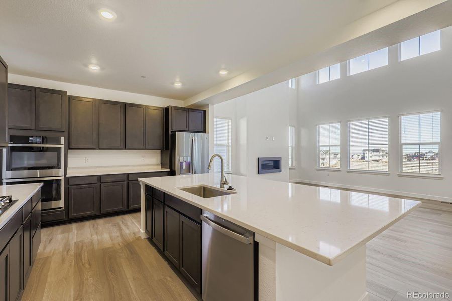 Furnished interior view inside a new home in Sunset Village: The Grand Collection, Erie (Image 5).