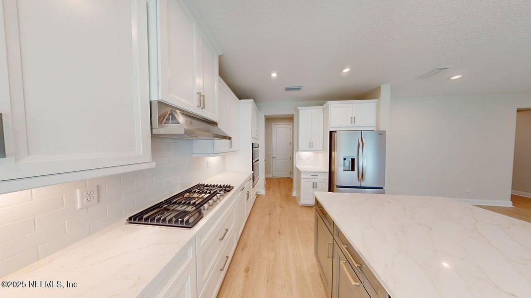 Furnished interior view inside a new home in RiverTown - WaterSong, St. Johns (Image 7).