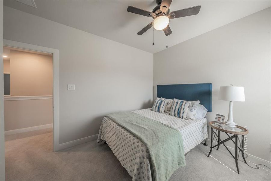 Bedroom with carpet flooring and ceiling fan