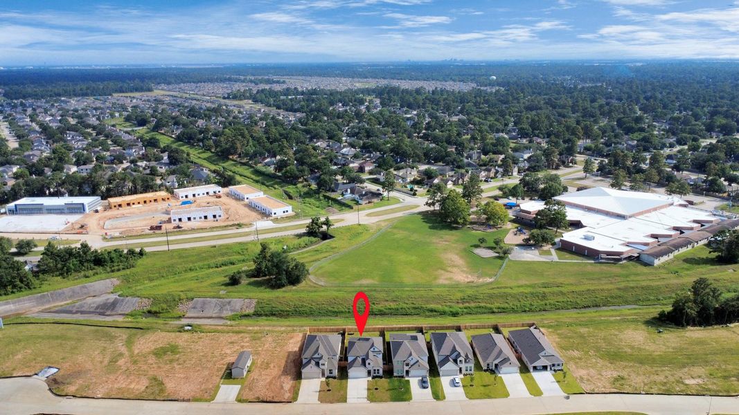 An aerial view of a spacious subdivision lot, highlighting a well-maintained yard and a fully fenced perimeter, offering both privacy and expansive outdoor space. An aerial view of a spacious subdivision lot, highlighting a well-maintained yard and a fully fenced perimeter, offering both privacy and expansive outdoor space.