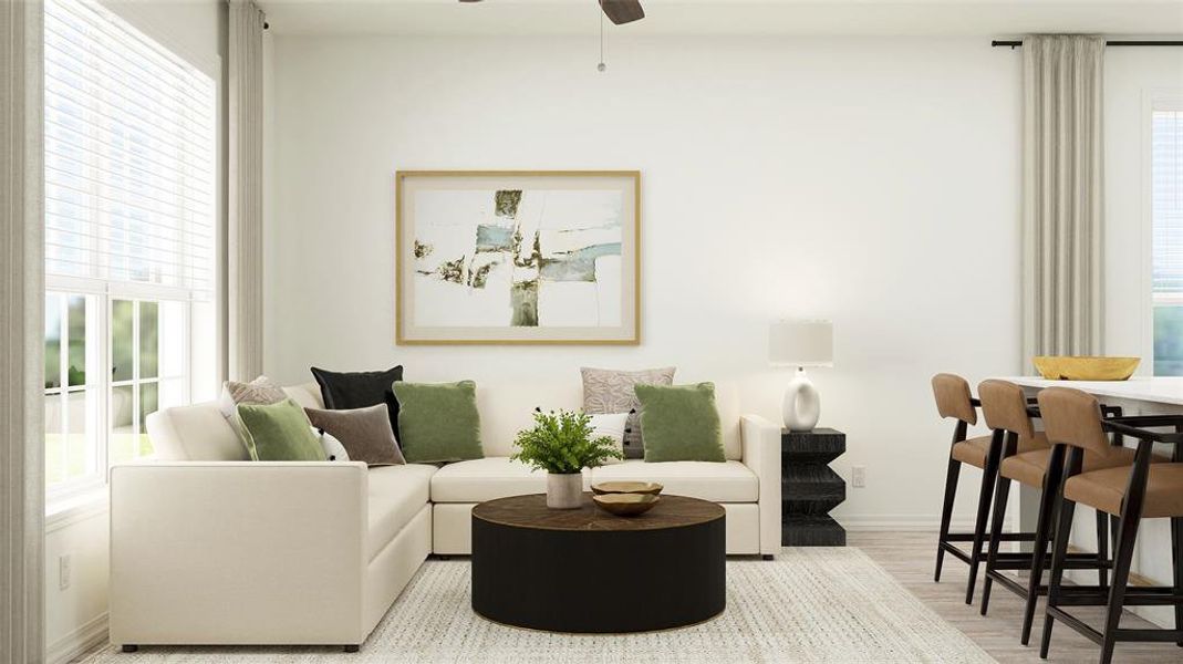 Living room with light hardwood / wood-style flooring and ceiling fan