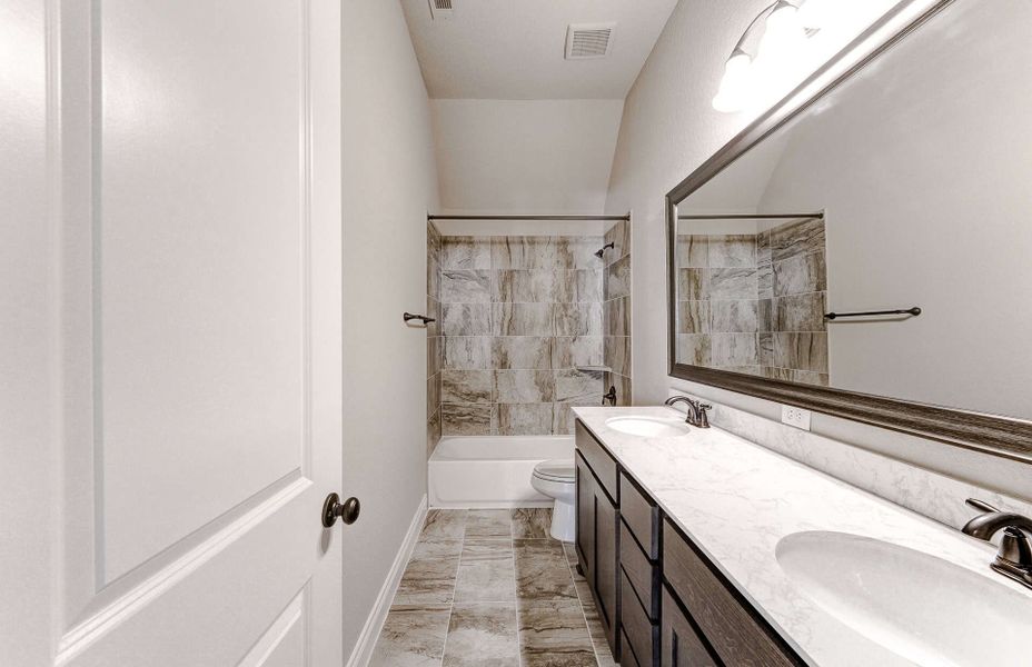 Representative furnished interior of a home built from the 3799 by Ravenna Homes in Artavia 70′, Conroe (Image 20).