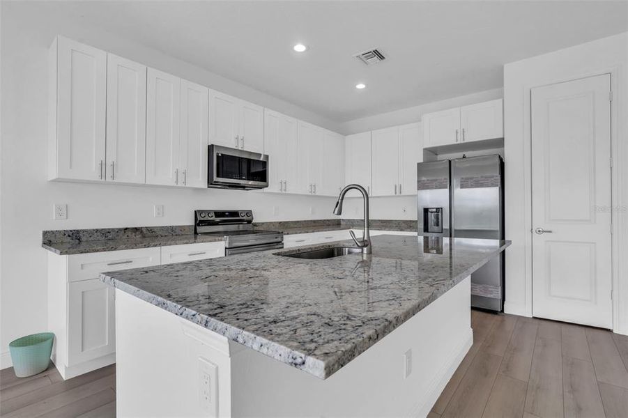 Furnished interior view inside a new home in , Okeechobee (Image 9).