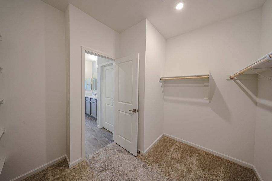 A hallway with white walls. A hallway with white walls.