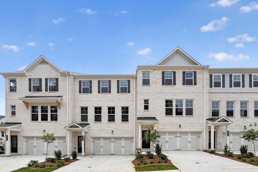 Front exterior of a new home in Somerset at Veterans Memorial, Mableton, GA, highlighting curb appeal (Image 19). Front exterior of a new home in Somerset at Veterans Memorial, Mableton, GA, highlighting curb appeal (Image 19).