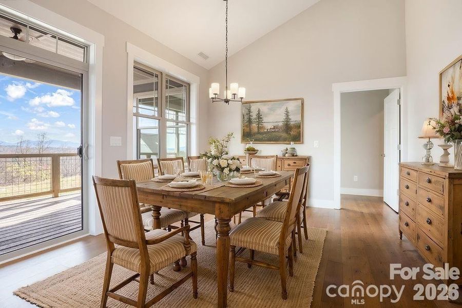 Dining room with vaulted ceiling. Virtually staged. Similar Model Home. Dining room with vaulted ceiling. Virtually staged. Similar Model Home.