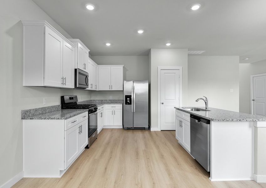 Kitchen includes all appliances, granite countertops and white cabinetry with hardware. Kitchen includes all appliances, granite countertops and white cabinetry with hardware.