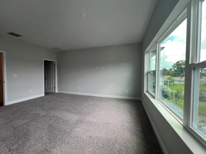 Spacious, unfurnished interior of a new home in The Towns At Long Bayou, Seminole (Image 15).