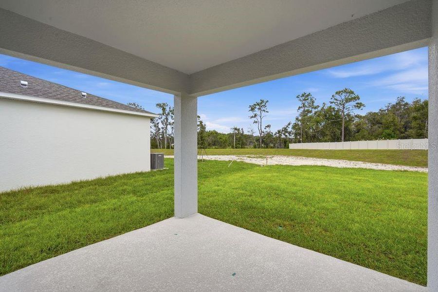 Exterior details and patio area of a home in Palm Wind, Hudson (Image 2).