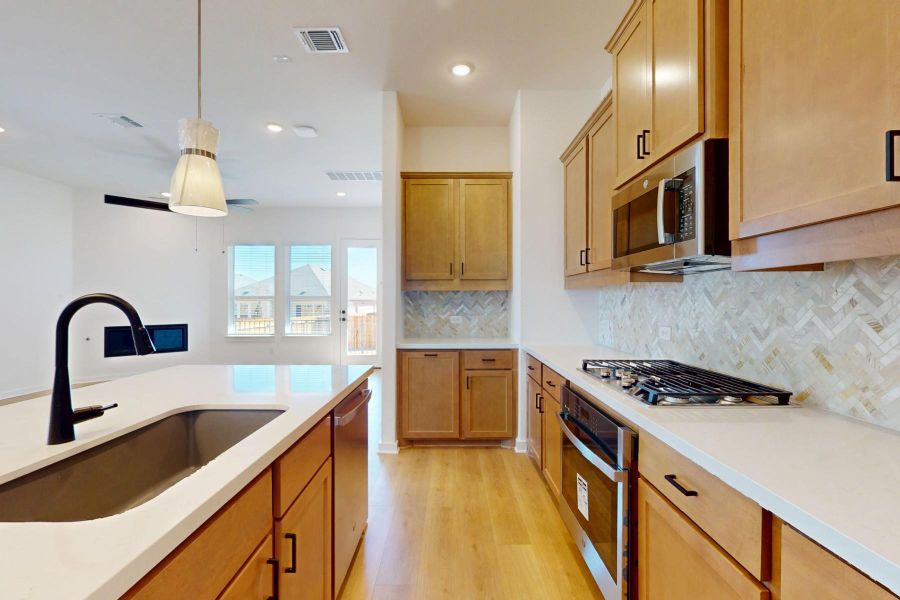 Furnished interior view inside a new home in Heritage, Dripping Springs (Image 7).