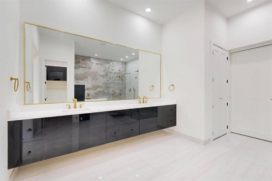 Full bath with double vanity, a marble finish shower, recessed lighting, and tile patterned floors Full bath with double vanity, a marble finish shower, recessed lighting, and tile patterned floors