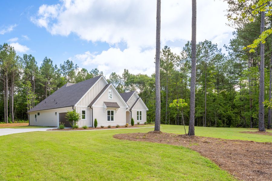 Front exterior of a new home in Flint Farms, Concord, GA, highlighting curb appeal (Image 25).