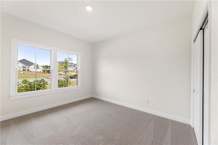 Spacious, unfurnished interior of a new home in The Courtyards of Franklin Goldmine, Cumming (Image 17).