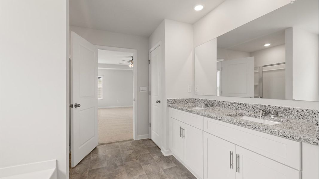 Representative furnished interior of a home built from the Mansfield by D.R. Horton in Highland Hills, Graniteville (Image 9).