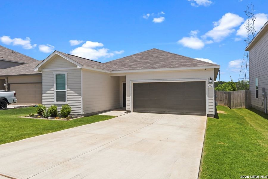 Front exterior of a new home in Briarwood Oaks, San Antonio, TX, highlighting curb appeal (Image 20).