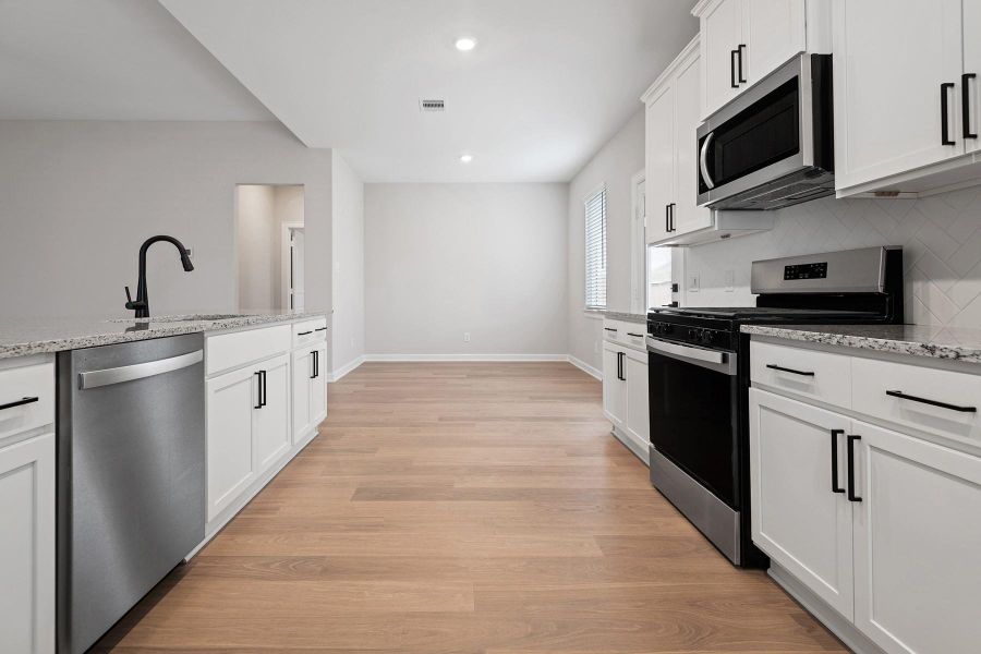 Furnished interior view inside a new home in Cypress Trails at Bauer Landing, Hockley (Image 5).