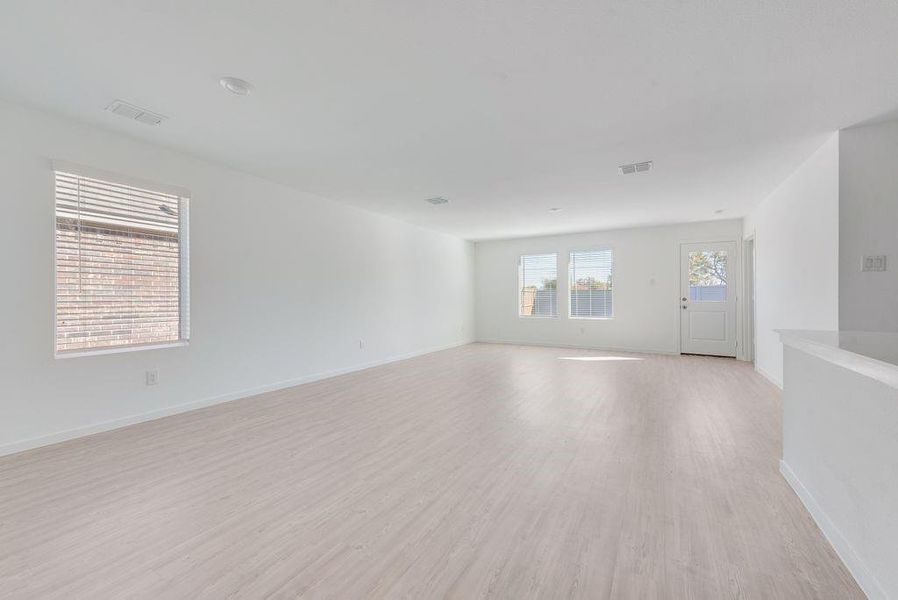 Unfurnished room featuring light wood-type flooring