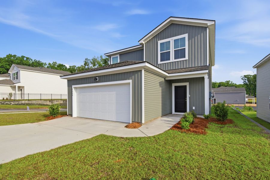 Front exterior of a new home in Grand Arbor, Blythewood, SC, highlighting curb appeal (Image 19). Front exterior of a new home in Grand Arbor, Blythewood, SC, highlighting curb appeal (Image 19).