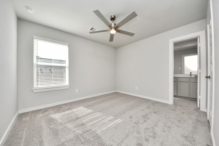 Generously sized secondary bedrooms featuring spacious closets, soft and inviting carpeting underfoot, large windows allowing plenty of natural light, and the added touch of privacy blinds for your personal retreat.