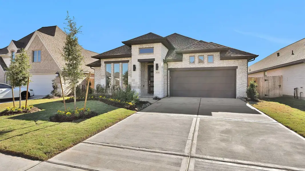 Front exterior of a new home in Stonecreek Estates 50', Richmond, TX, highlighting curb appeal (Image 2).