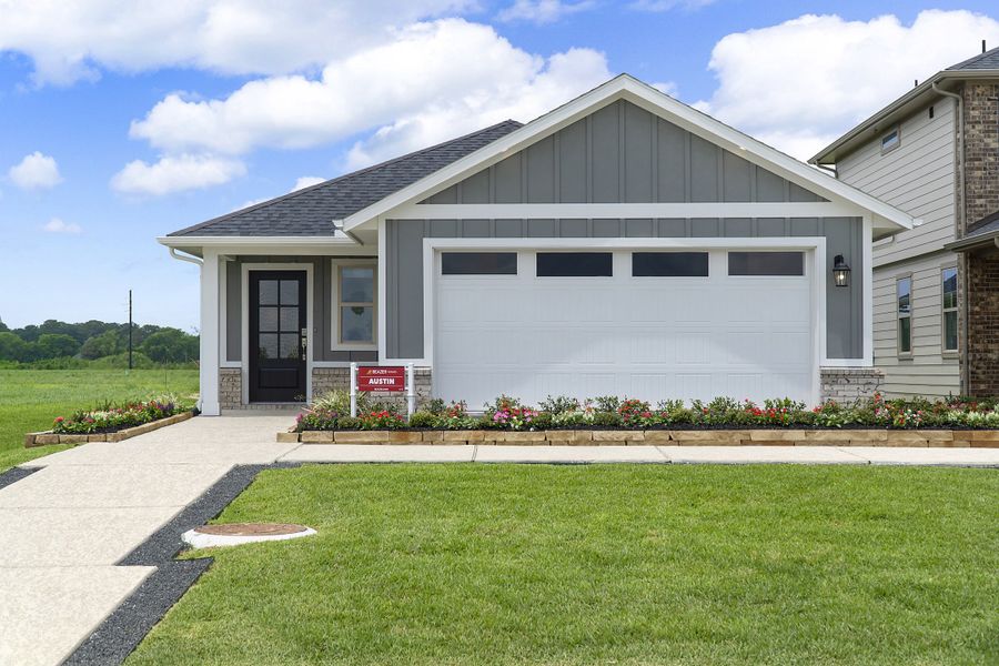 Front exterior of a new home in Montgomery Ridge, Montgomery, TX, highlighting curb appeal (Image 2). Front exterior of a new home in Montgomery Ridge, Montgomery, TX, highlighting curb appeal (Image 2).