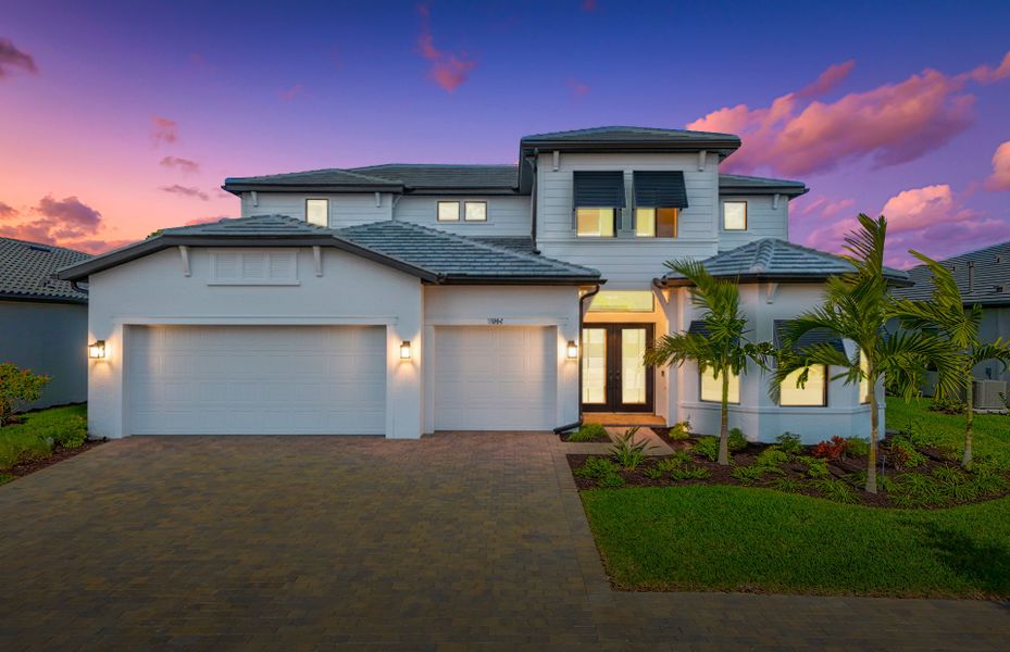 Front exterior of a new home in Terreno, Naples, FL, highlighting curb appeal (Image 2). Front exterior of a new home in Terreno, Naples, FL, highlighting curb appeal (Image 2).