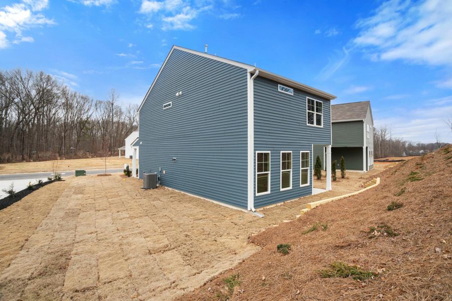 Front exterior of a new home in Chandler Ridge, McLeansville, NC, highlighting curb appeal (Image 20). Front exterior of a new home in Chandler Ridge, McLeansville, NC, highlighting curb appeal (Image 20).