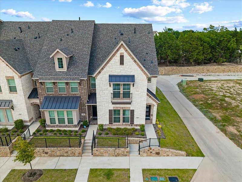 Front exterior of a new home in Bayside, Rowlett, TX, highlighting curb appeal (Image 22). Front exterior of a new home in Bayside, Rowlett, TX, highlighting curb appeal (Image 22).