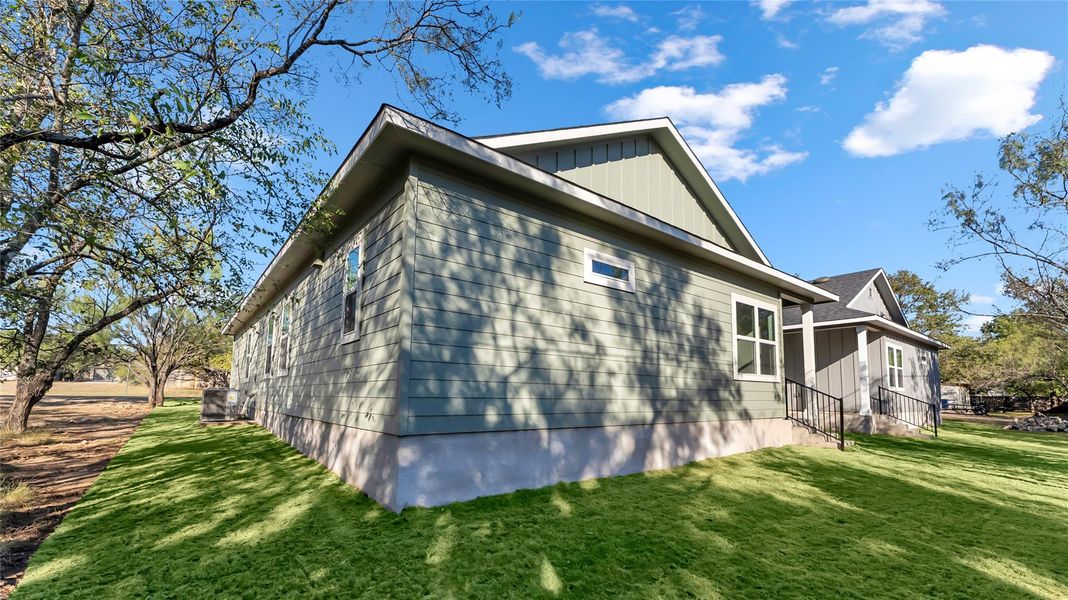 Front exterior of a new home in , Cottonwood Shores, TX, highlighting curb appeal (Image 14).