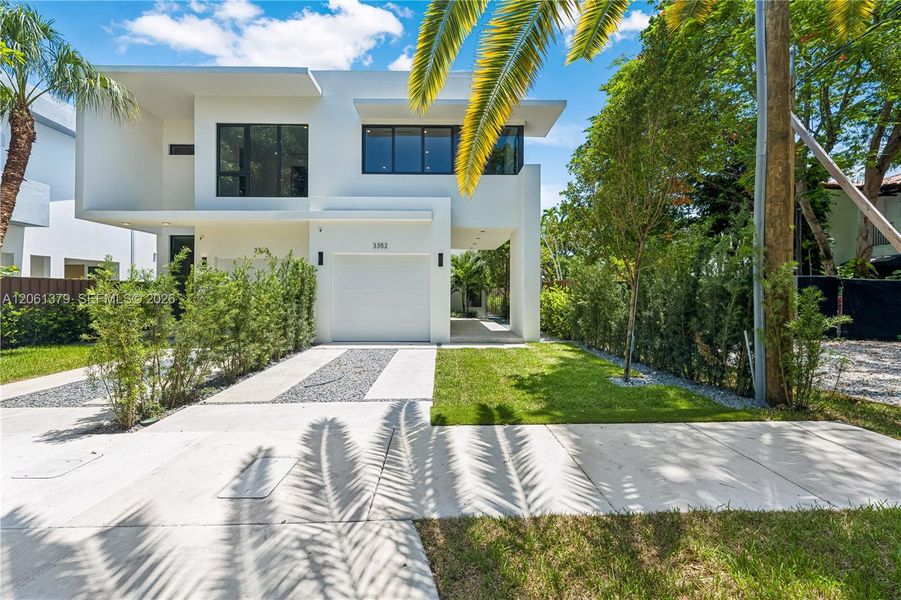 Front exterior of a new home in , Miami, FL, highlighting curb appeal (Image 1). Front exterior of a new home in , Miami, FL, highlighting curb appeal (Image 1).
