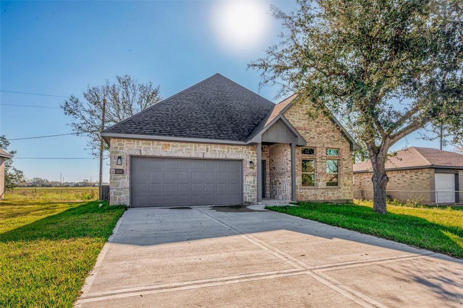 Front exterior of a new home in , Needville, TX, highlighting curb appeal (Image 20).