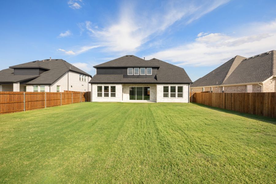 Exterior details and patio area of a home in Lake Breeze, Lavon (Image 24).