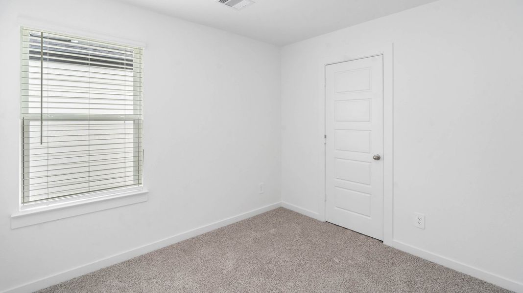 Representative unfurnished interior of a home built from the Jasmine by D.R. Horton in Grand West, Houston (Image 22).