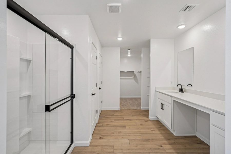 Primary bath. Not actual home, finishes may vary by community.